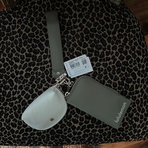 lululemon athletica strap keychain wallet in olive green and white